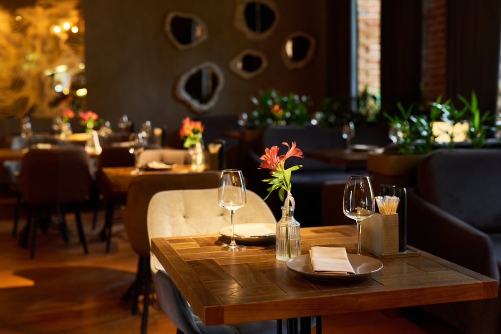 Elegant restaurant dining table setting representing commercial property damage claims.
